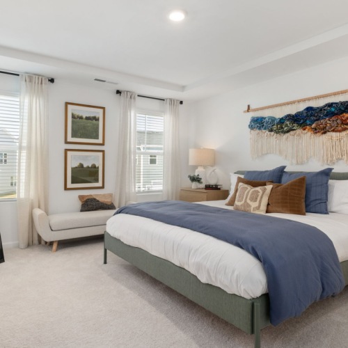bedroom with bed end tables and lamp