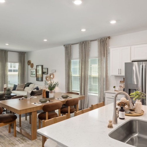 kitchen with island dining table and large window